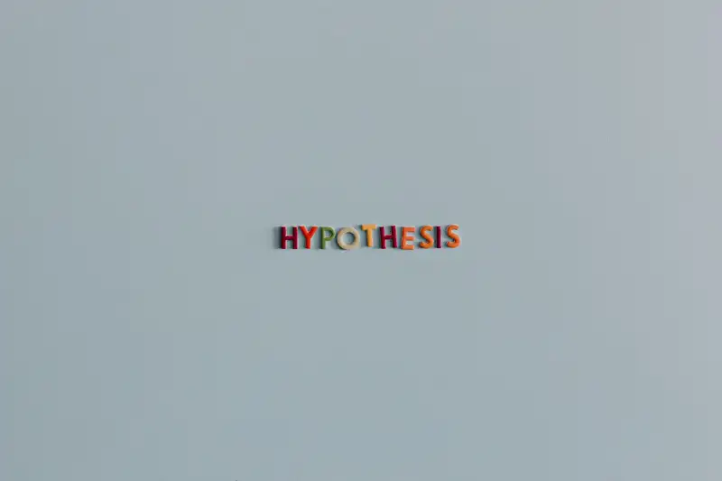 Minimalist image with colorful letters spelling 'Hypothesis' on a light background.